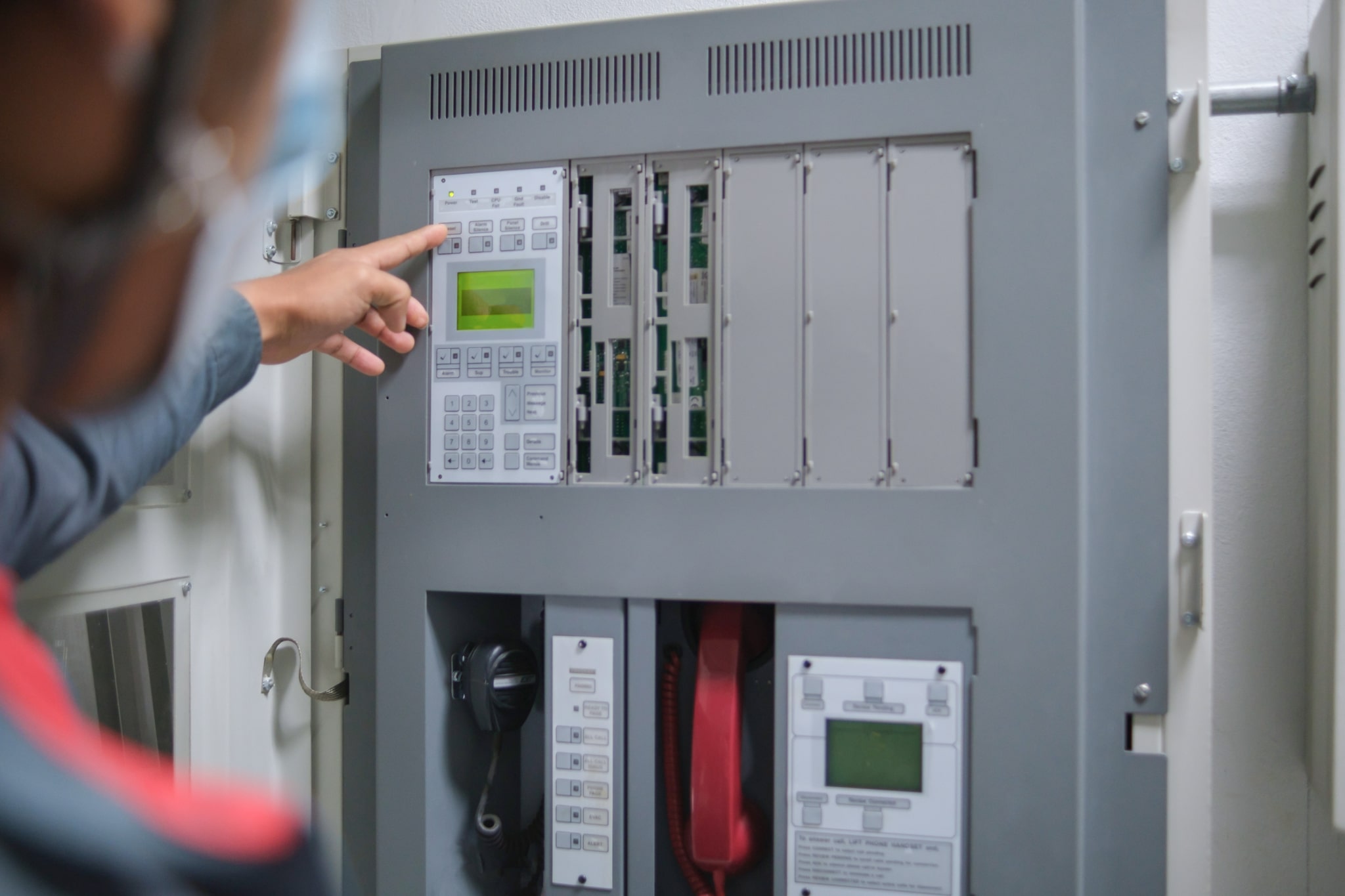 Fire alarm annunciator panel displaying system alerts.