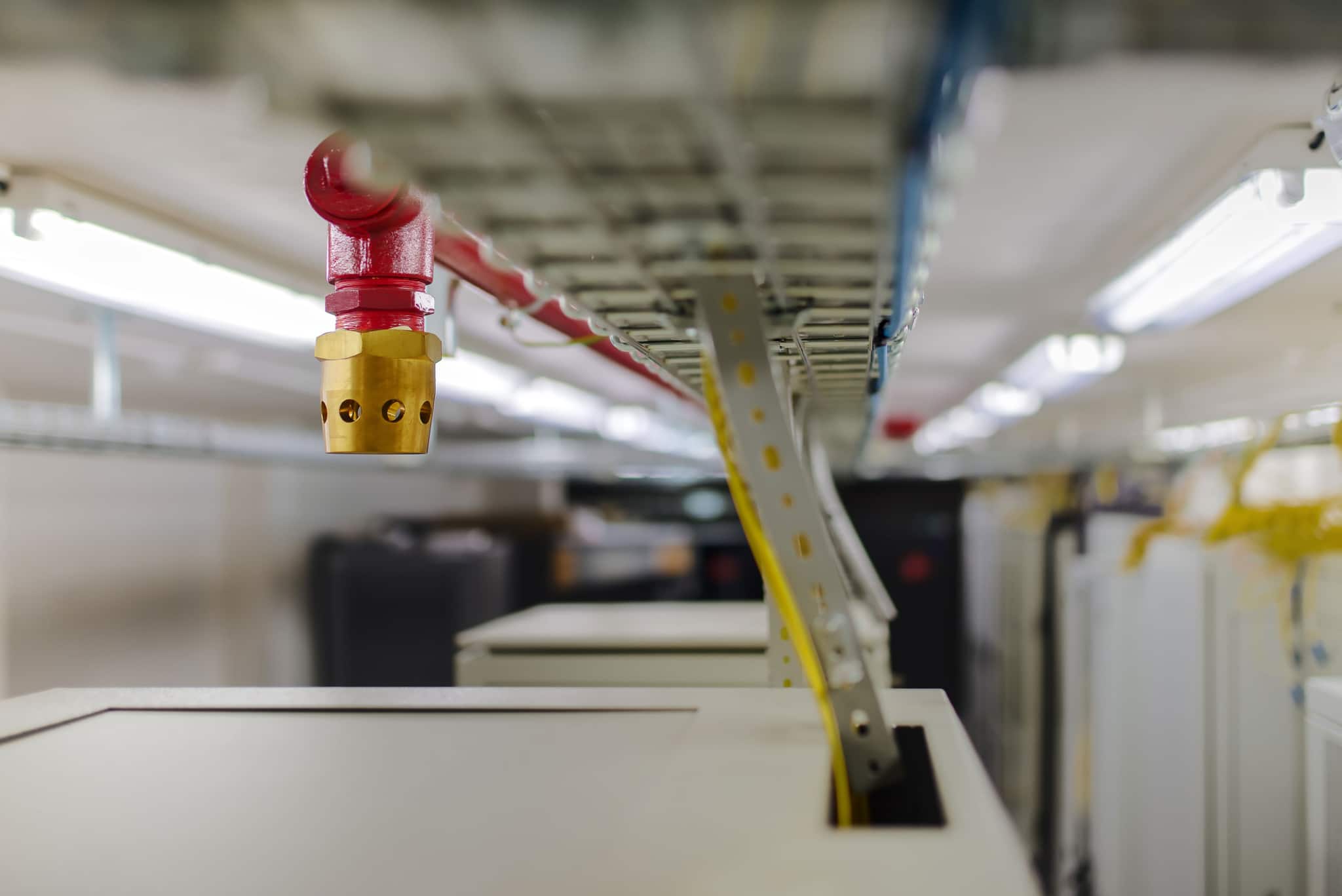 Fire suppression nozzle in a server room